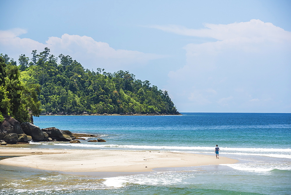 Tourist walking on Sungai Pinang Beach, near Padang in West Sumatra, Indonesia, Southeast Asia, Asia