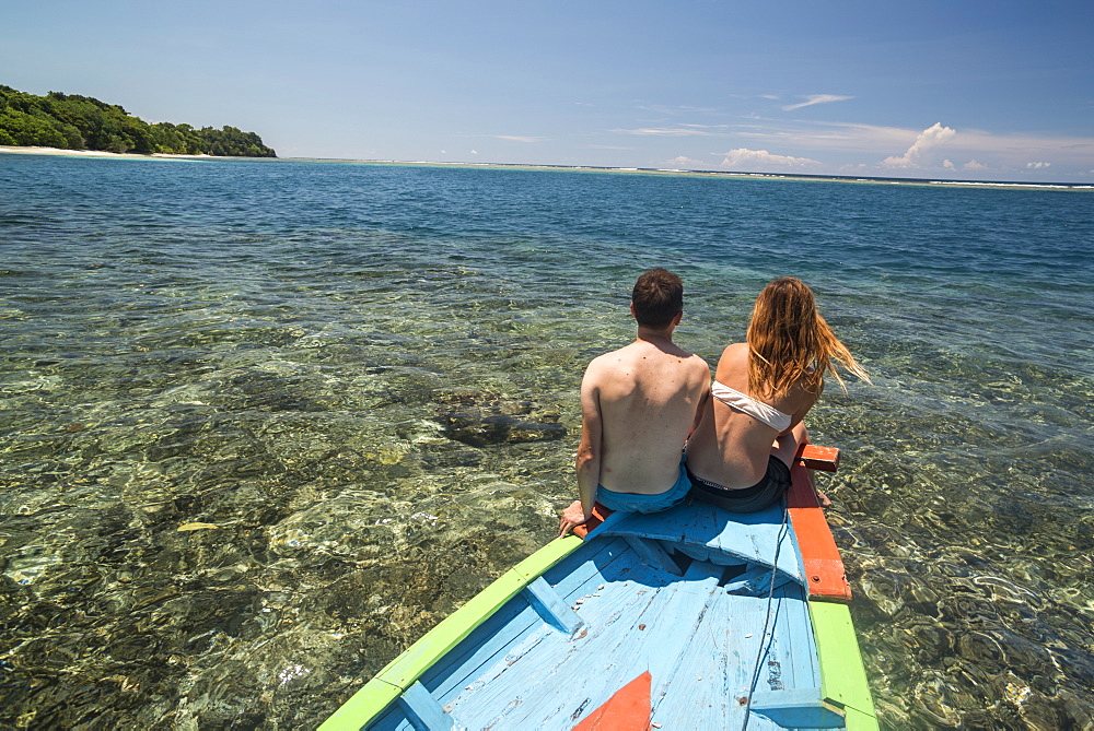 Couple on a traditional Indonesian boat trip to Marak Island, a tropical island near Padang in West Sumatra, Indonesia, Southeast Asia, Asia