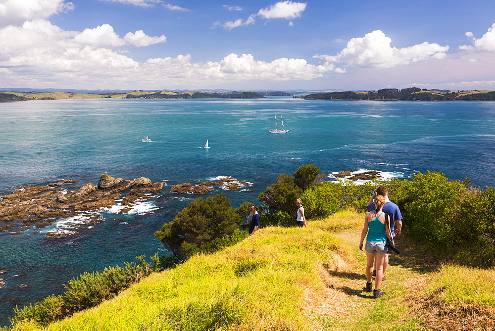 Family walking on Tapeka Point, Russell, Northland Region, North Island, New Zealand, Pacific