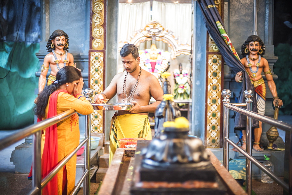 Hindus worshipping and praying at Batu Caves, Kuala Lumpur, Malaysia, Southeast Asia, Asia