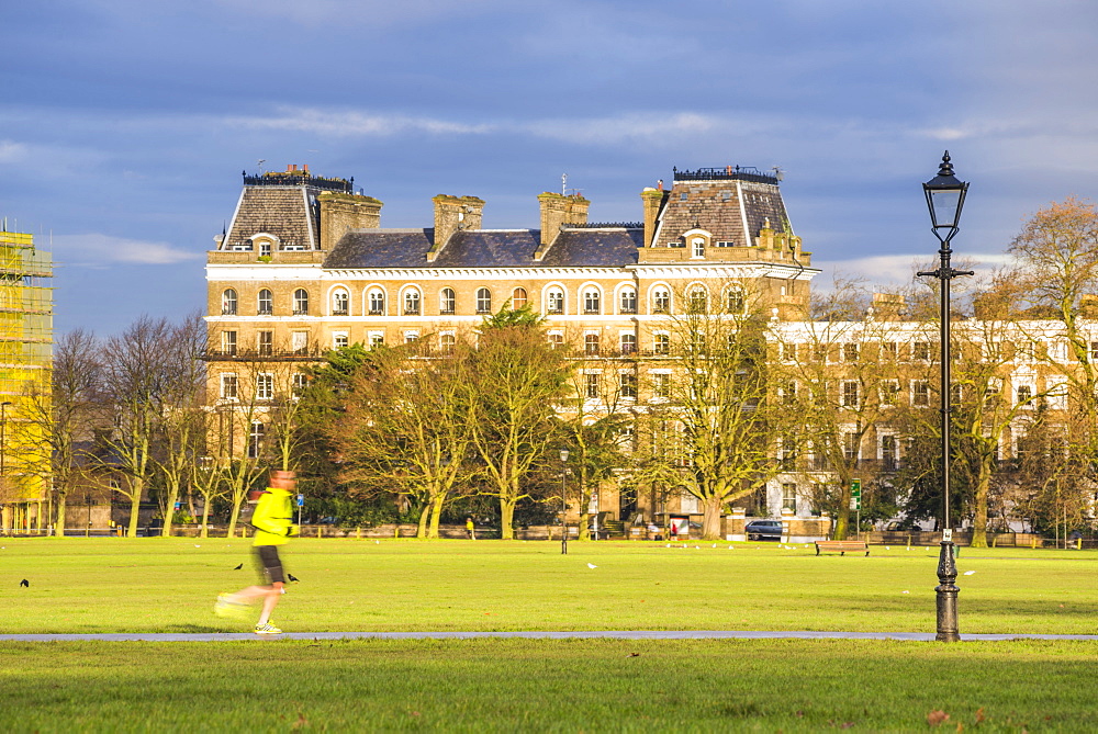 Jogger jogging on Clapham Common, Lambeth Borough, London, England, United Kingdom, Europe