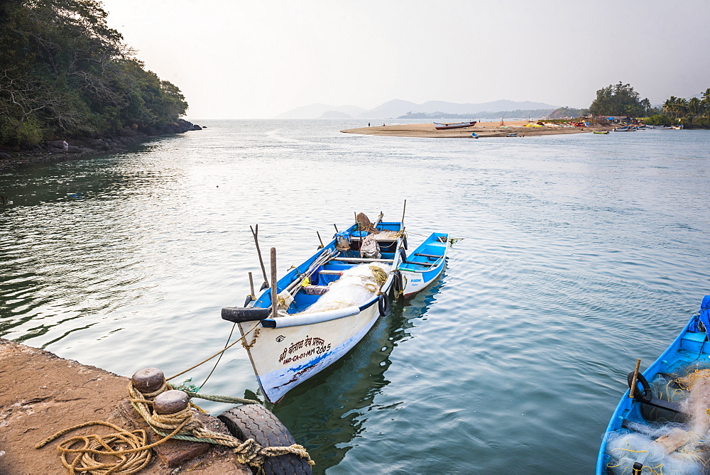 Fishing boats in a port at Talpona Beach, South Goa, India, Asia