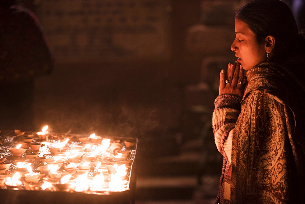 Praying at a Hindu temple in Varanasi, Uttar Pradesh, India, Asia