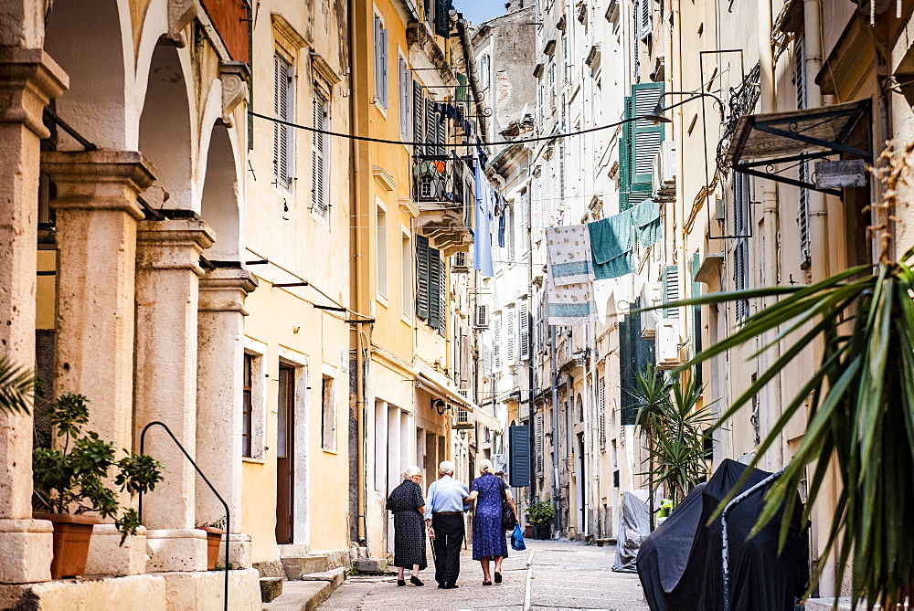 People walking along alley in old town of Corfu, Corfu Island, Ionian Islands, Greece, Europe