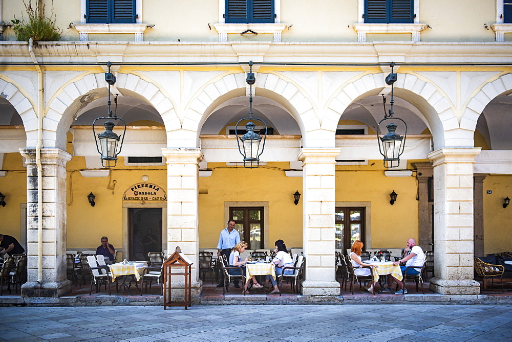 People dining under arches at restaurant in old town of Corfu, Corfu Island, Ionian Islands, Greece, Europe