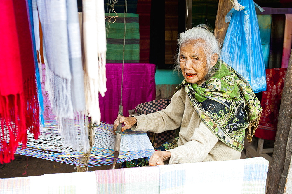 Old woman weaving scarves at her loom, Luang Prabang, Laos, Indochina, Southeast Asia, Asia