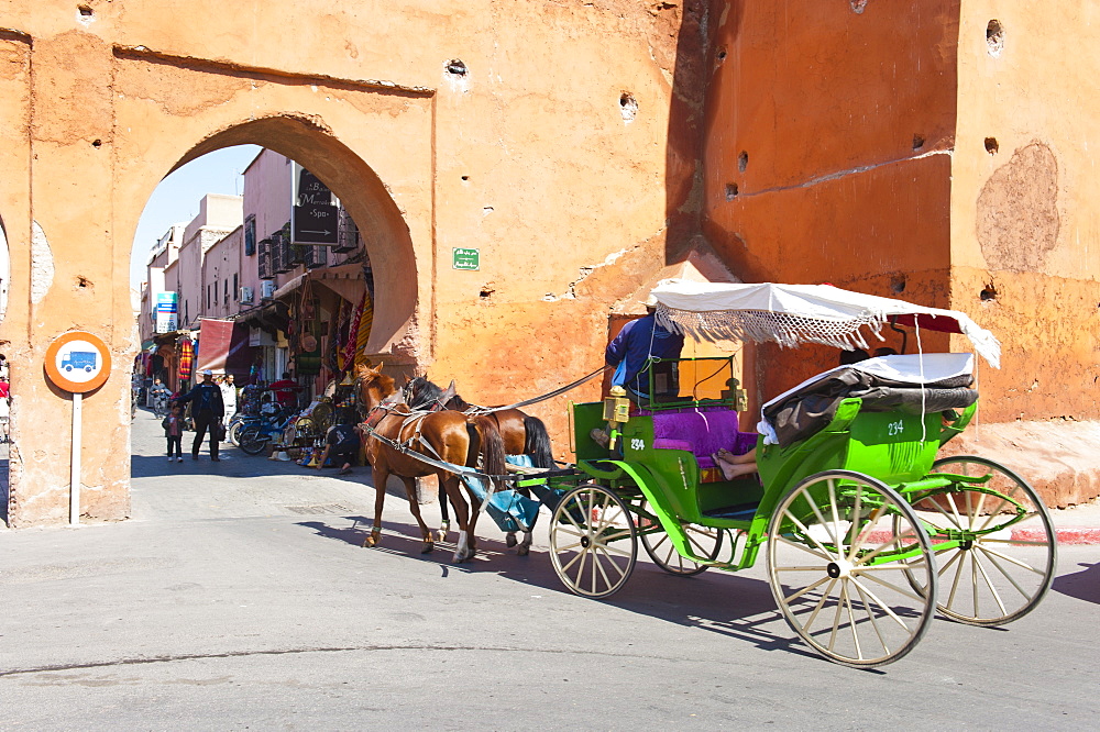 Tourists in Marrakech enjoying a horse and cart ride around the old medina, Marrakech, Morocco, North Africa, Africa 