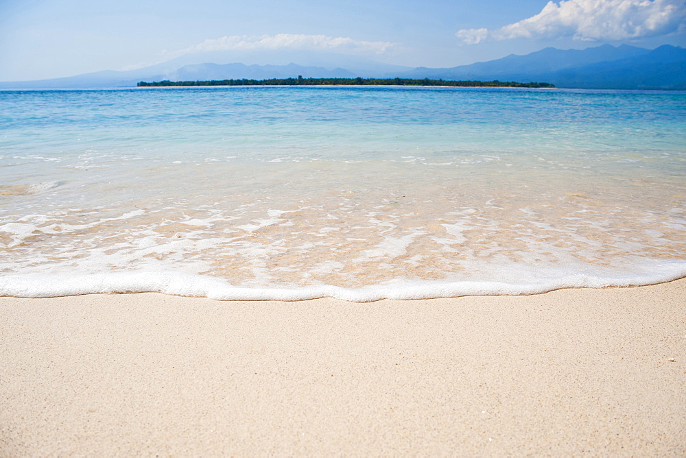 The tropical island of Gili Air, with Gili Meno beach in the foreground, Gili Isles, Indonesia, Southeast Asia, Asia