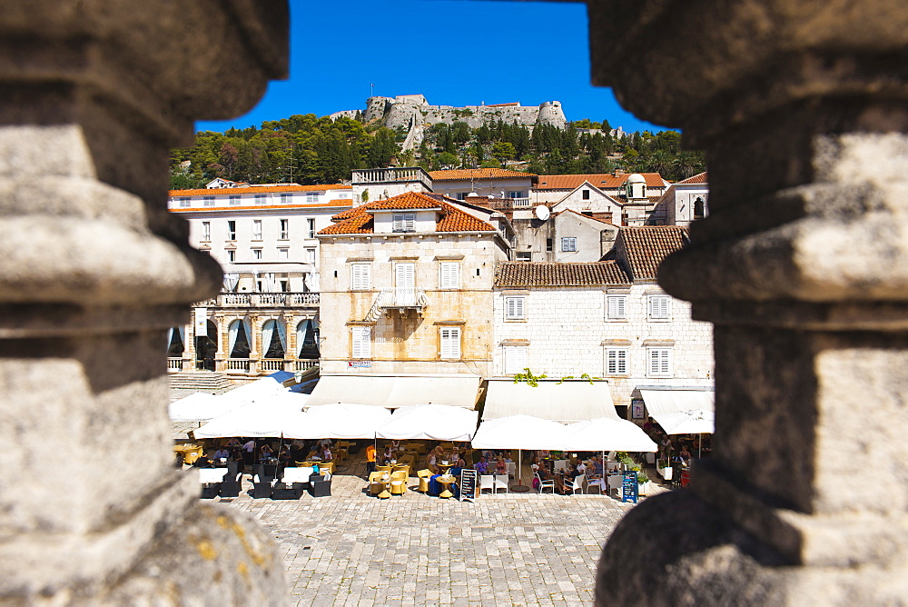 Spanish Fortress above St. Stephens Square cafes, Hvar Town, Hvar Island, Dalmatian Coast, Croatia, Europe 