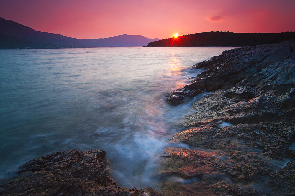 Sun star at sunrise in Korcula Town, Korcula Island, Dalmatian Coast, Adriatic, Croatia, Europe