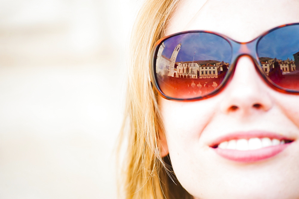 Dubrovnik City Bell Tower reflected in a tourist's sunglasses, Dubrovnik, Dalmatia, Croatia, Europe 