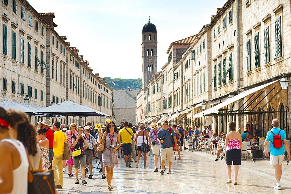 Dubrovnik City Tour on Stradun and the Franciscan Monastery in the background, Dubrovnik Old Town, UNESCO World Heritage Site, Dubrovnik, Croatia, Europe