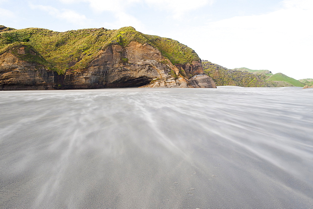 Sand being blown along windy Wharariki Beach, Golden Bay, Tasman Region, South Island, New Zealand, Pacific 