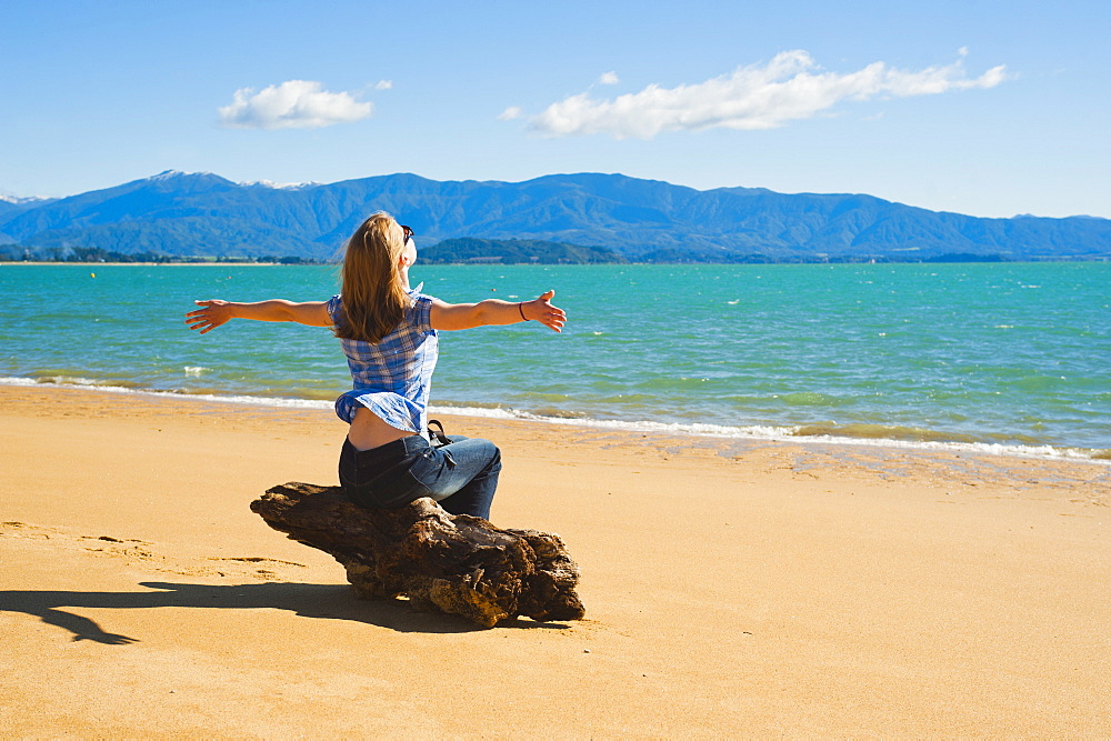 Woman on the beach at Tata Beach, Golden Bay, Tasman Region, South Island, New Zealand, Pacific 