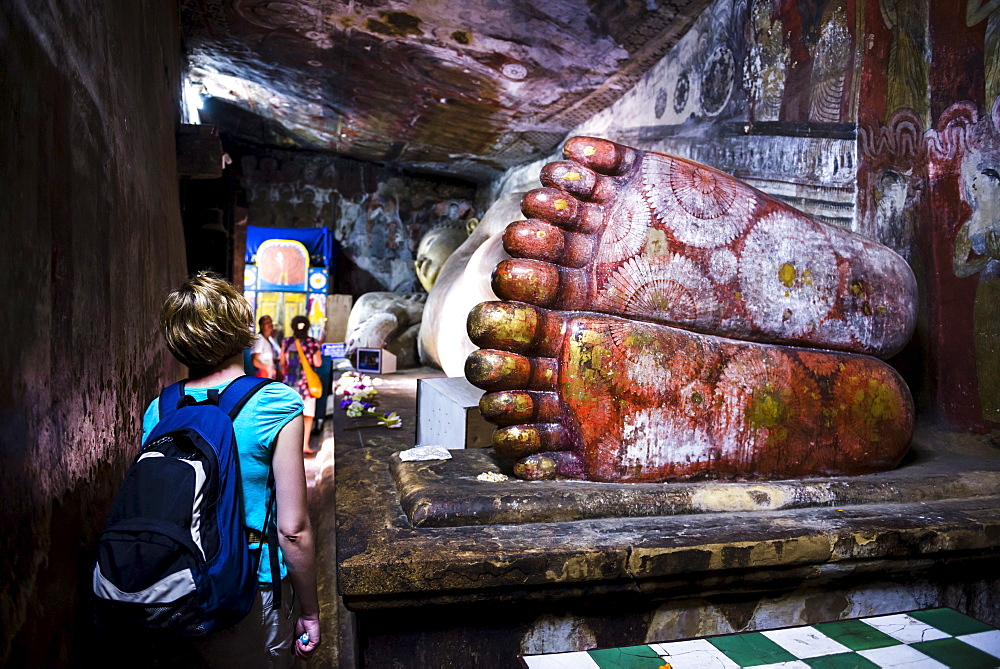 Tourist visiting Cave 1 (Cave of the Divine King), Dambulla Cave Temples, UNESCO World Heritage Site, Dambulla, Central Province, Sri Lanka, Asia