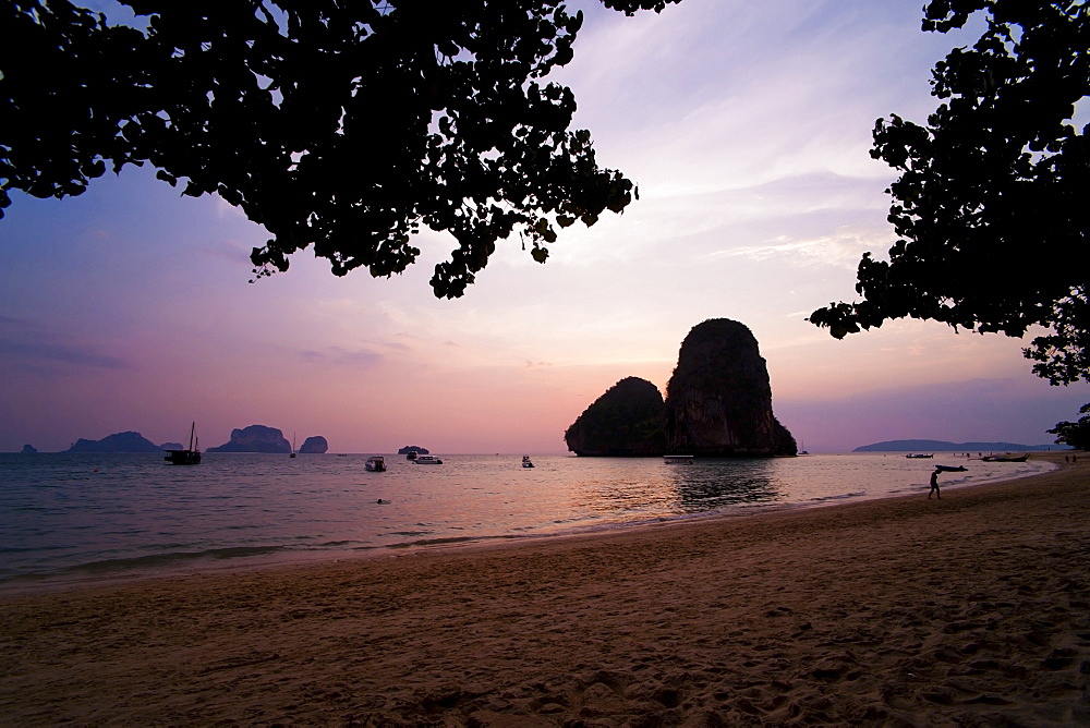 Colourful purple tropical sunset at Ao Phra Nang Beach, Railay (Rai Leh), South Thailand, Southeast Asia, Asia