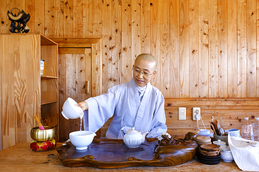 Tea ceremony at Yakcheonsa Buddhist Temple, the largest temple in Asia, measuring 30 meters high and spanning 3305 square meters, Jeju Island, South Korea, Asia