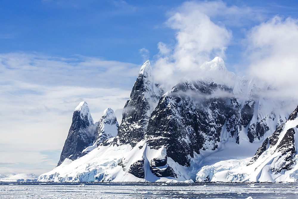 Snow-capped mountains of the Lemaire Channel, Antarctica, Southern Ocean, Polar Regions