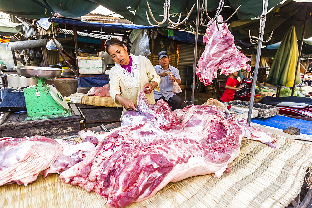 Fresh pork being prepared at street market in the capital city of Phnom Penh, Cambodia, Indochina, Southeast Asia, Asia