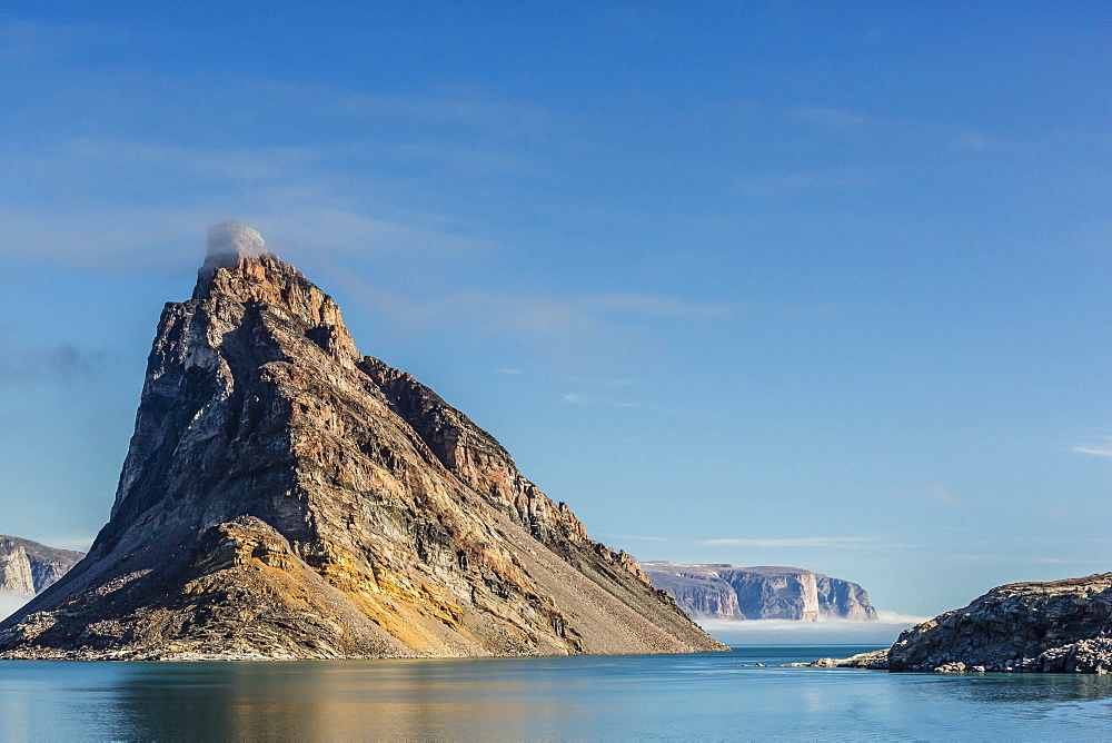 Fog lifting on the steep cliffs of Icy Arm, Baffin Island, Nunavut, Canada, North America 