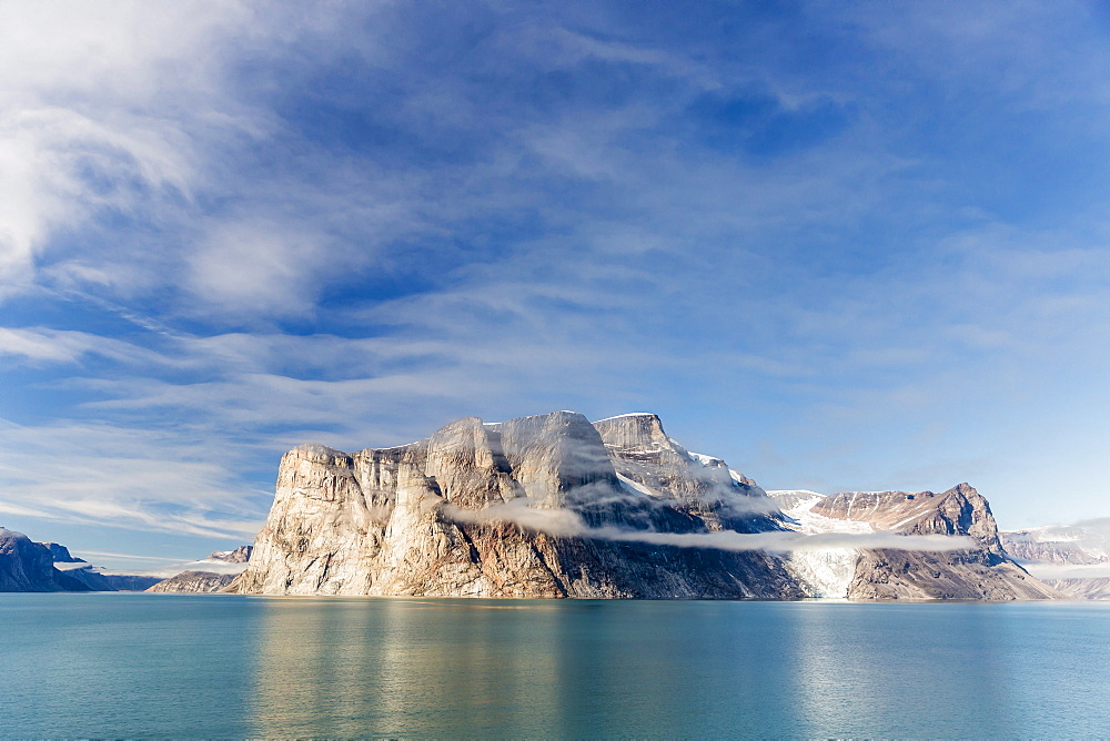 Fog lifting on the steep cliffs of Icy Arm, Baffin Island, Nunavut, Canada, North America