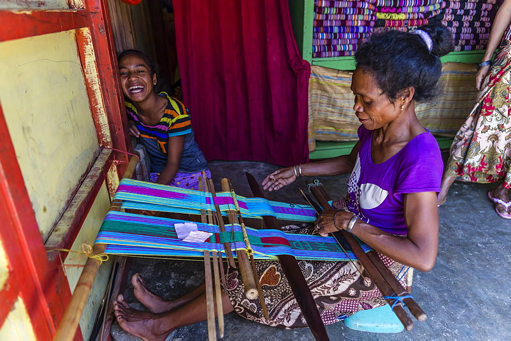 Woman weaving textiles in the capital city of Dili, East Timor, Southeast Asia, Asia