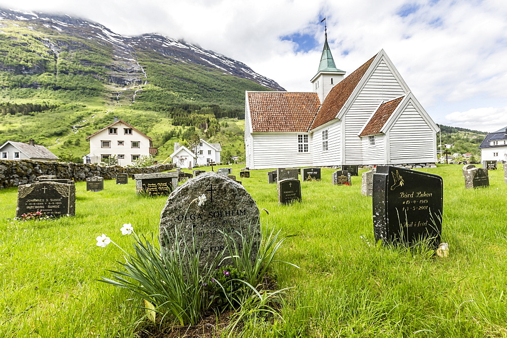 Cemetery in front of church in the town of Olden, Briksdalen, Nordfjord, Norway, Scandinavia, Europe