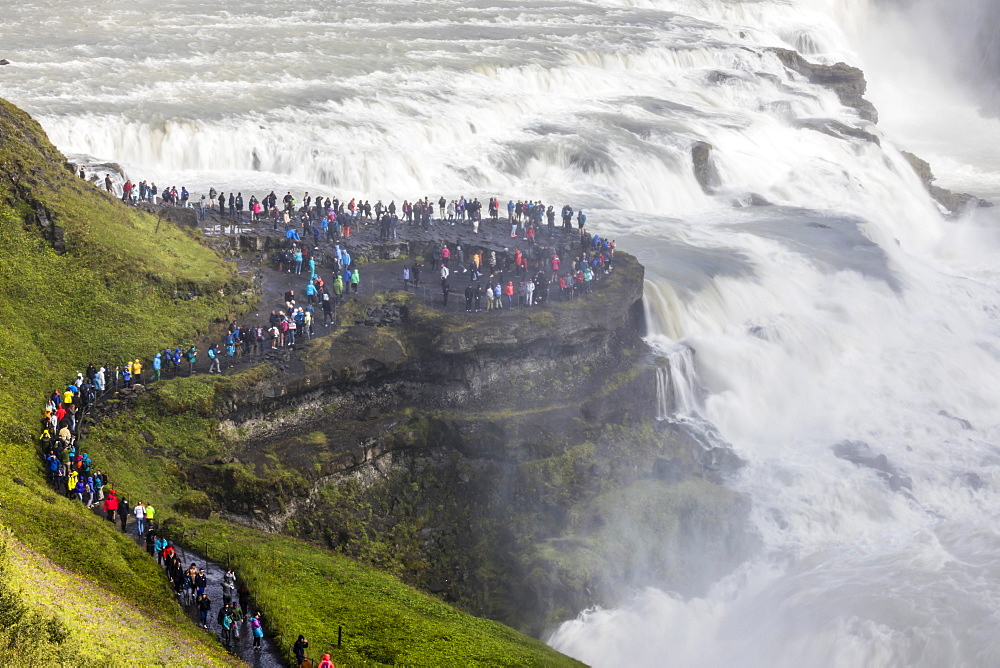 Tourists visiting iconic Gullfoss (Golden Falls), Olfusa River in southwest Iceland, Polar Regions