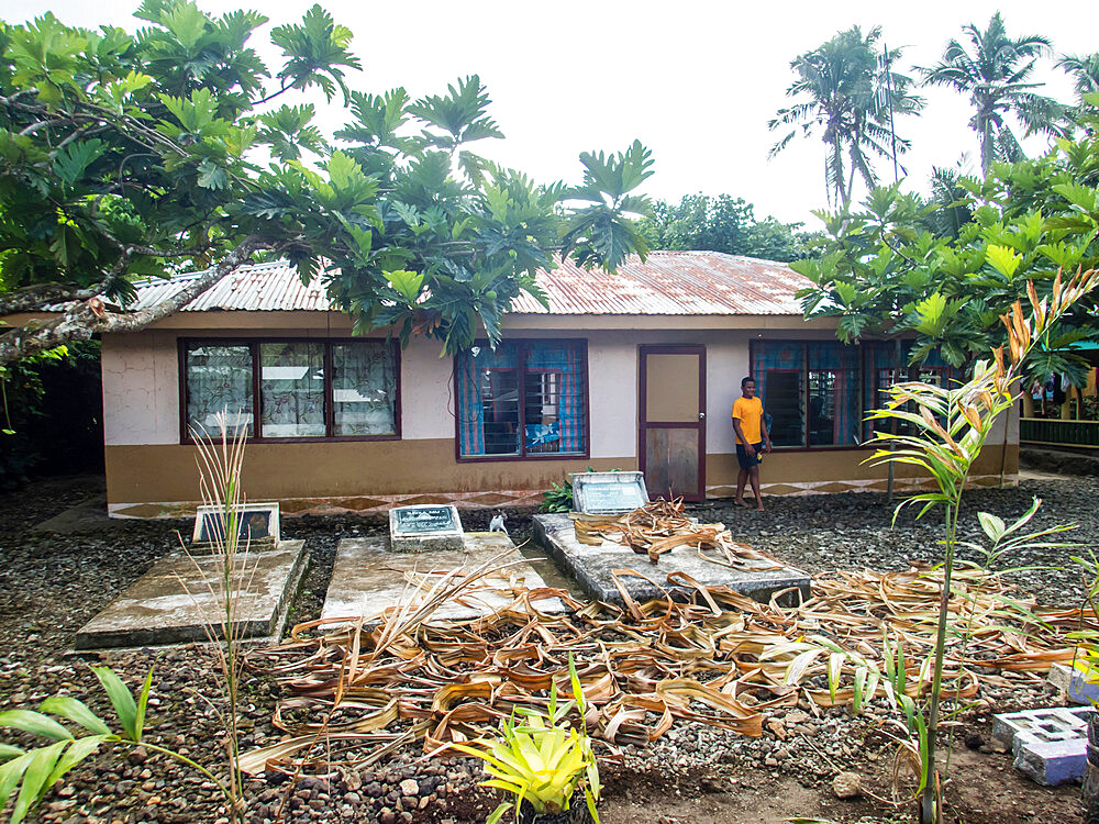 Ancestors graves in the front yard of a home in the town of Lufilufi on the island of Upolu, Samoa, South Pacific Islands, Pacific