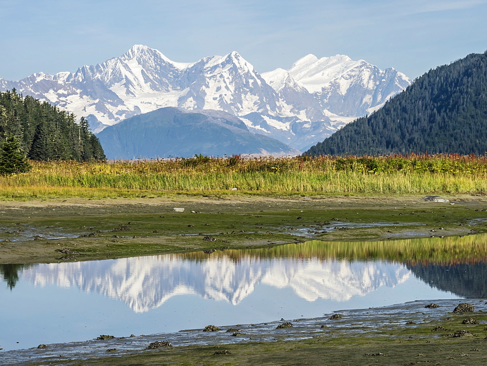 The Fairweather Range reflected in calm water, Fern Harbour, Glacier Bay National Park, Alaska, United States of America