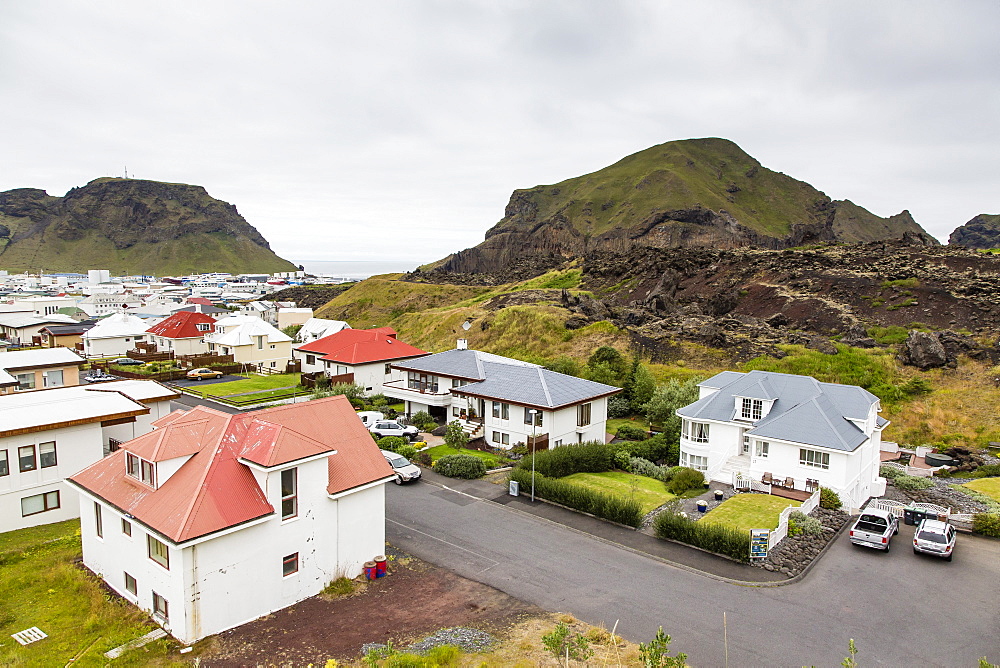 View over the town of Heimaey from recent lava flow on Heimaey Island, Iceland, Polar Regions