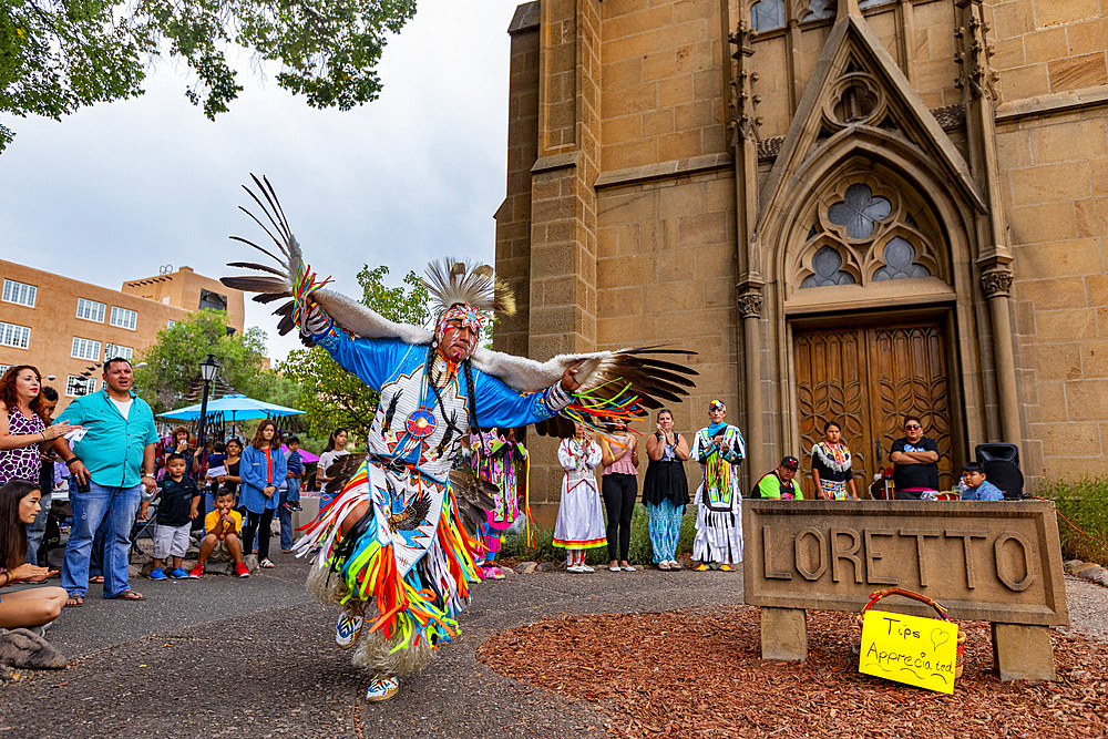 Santa Fe Indian Market participants in traditional regalia perform in downtown Santa Fe, New Mexico, United States of America, North America