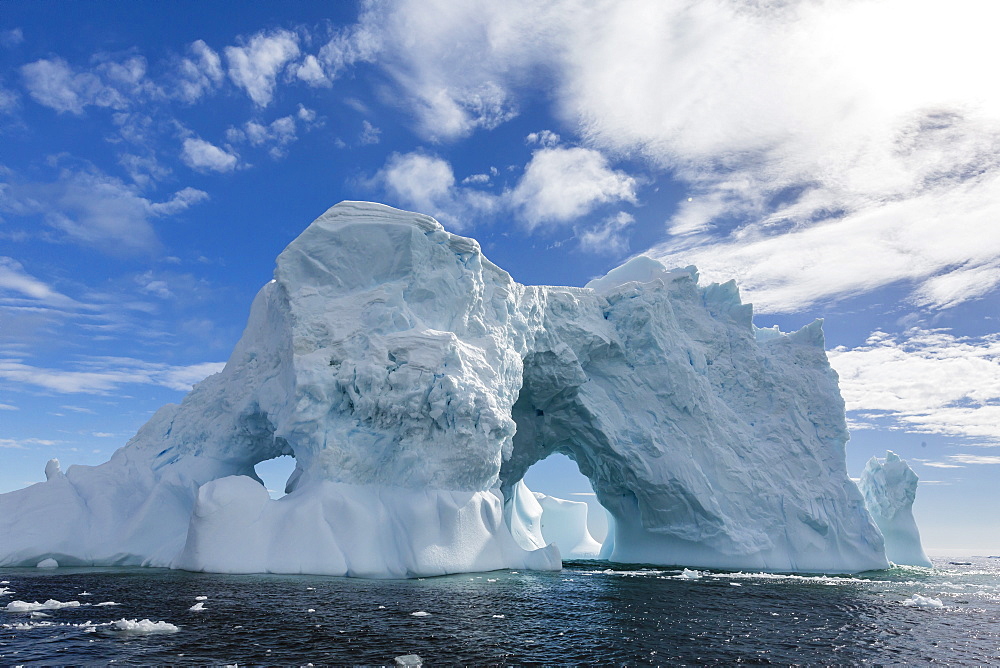 Huge arched iceberg near Petermann Island, western side of the Antarctic Peninsula, Southern Ocean, Polar Regions