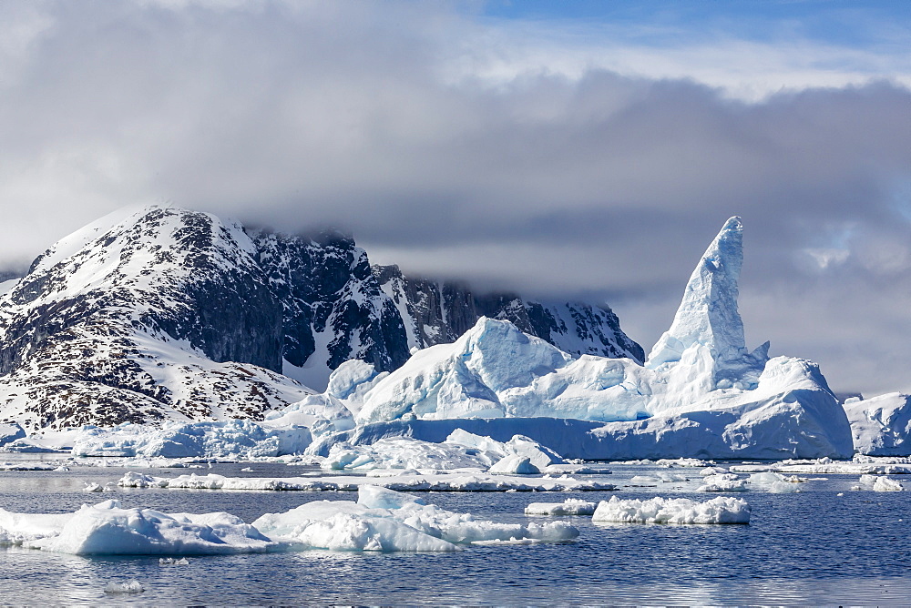 Huge iceberg amongst sea ice in the Yalour Islands, western side of the Antarctic Peninsula, Southern Ocean, Polar Regions