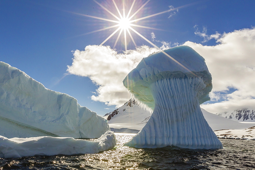 Huge mushroom shaped iceberg in Dorian Bay, western side of the Antarctic Peninsula, Southern Ocean, Polar Regions