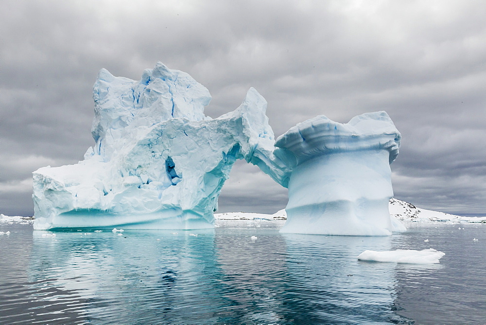 Huge arched iceberg near Petermann Island, western side of the Antarctic Peninsula, Southern Ocean, Polar Regions