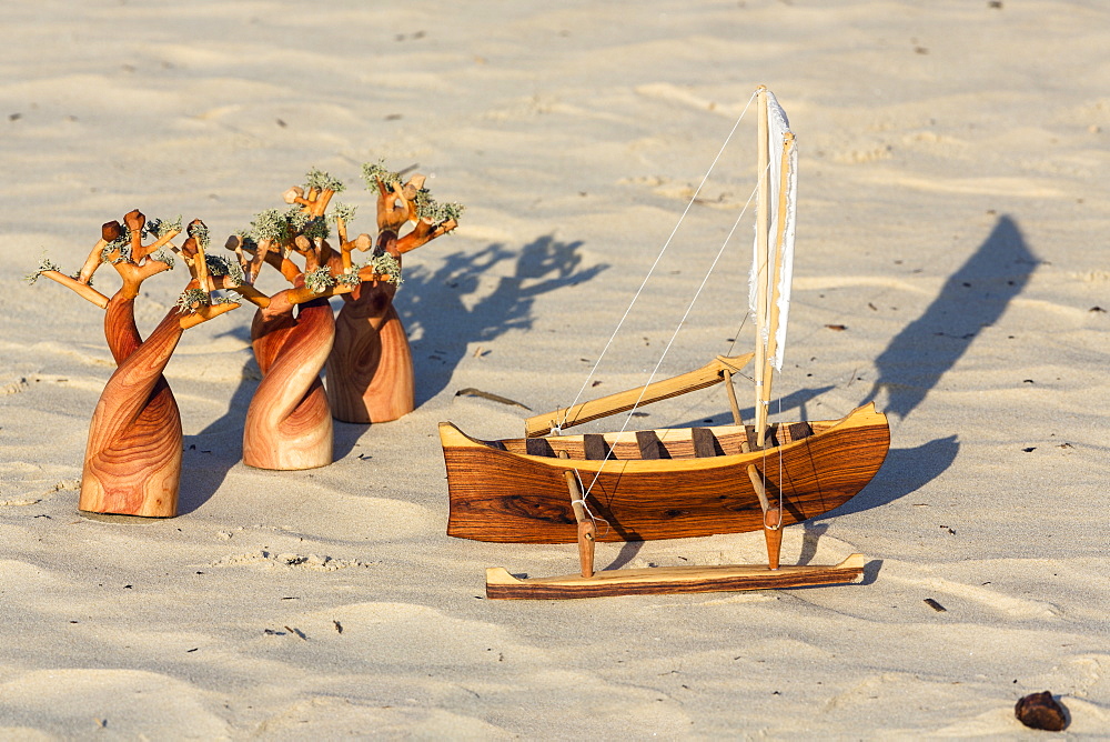 Woodcarvings in the sand, souvenirs, Baobab, Pirogue, Morondava, Madagascar, Africa