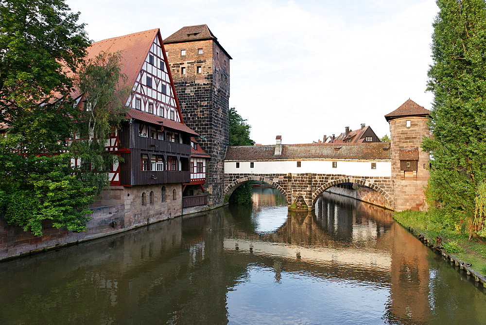 View of max bridge, the river Pegnitz, half-timbered building of the Weinstadel, water-tower and Henkersteg footbridge, Nuremberg, Middle Franconia, Bavaria, Germany