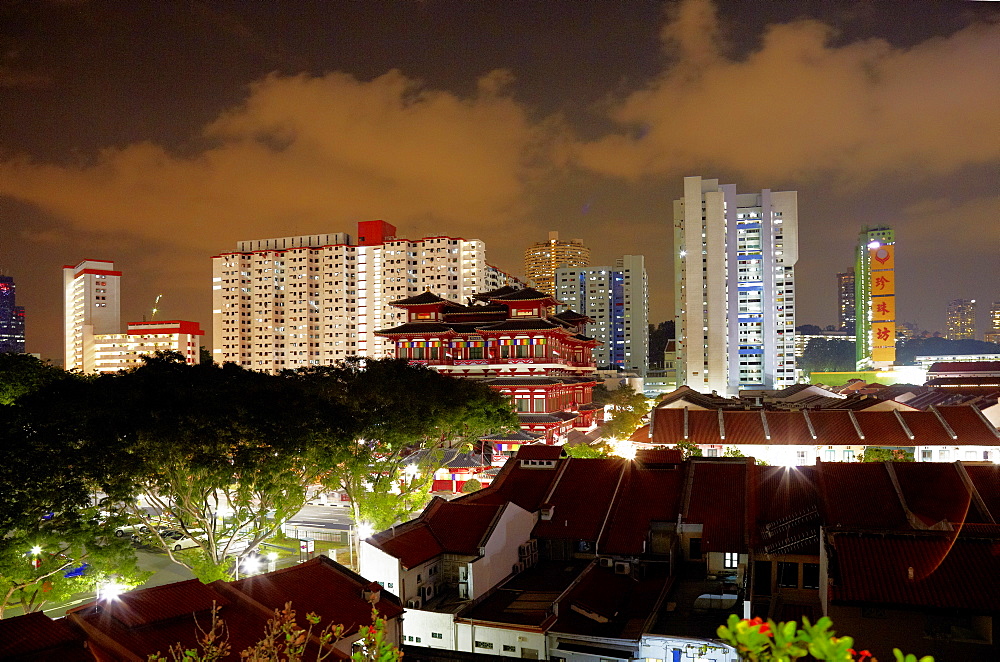 Buddha Tooth Relic Temple and Museum infront of skyline at night, Chinatown, Singapore