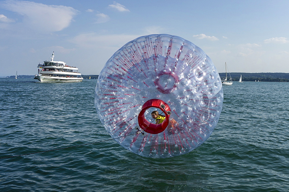 Fun Ball on Lake Constance in Ueberlingen, Ferry in the background, Baden-Wuerttemberg, Germany, Europe