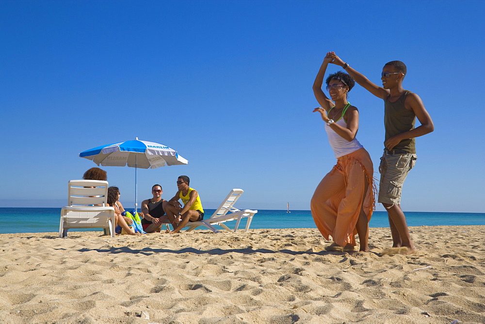 Young couple dancing salsa at beach, Playas del Este, Havana, Ciudad de La Habana, Cuba, West Indies