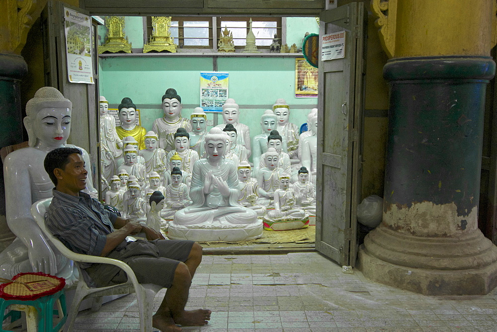 Shop with marble Buddhas at the Mahamuni pagoda in Mandalay, Myanmar, Burma