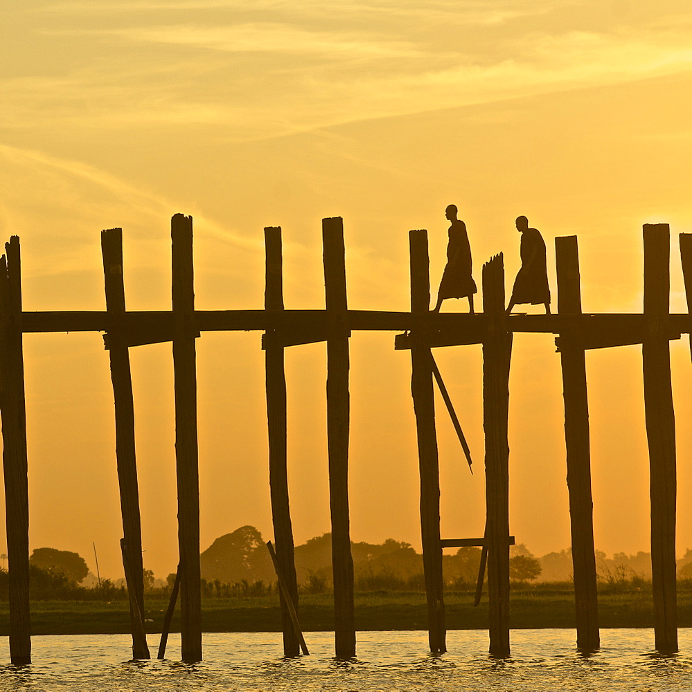 Two monks on the U Bein bridge, 1, 2 km long wooden bridge, Amarapura near Mandalay, Myanmar, Burma