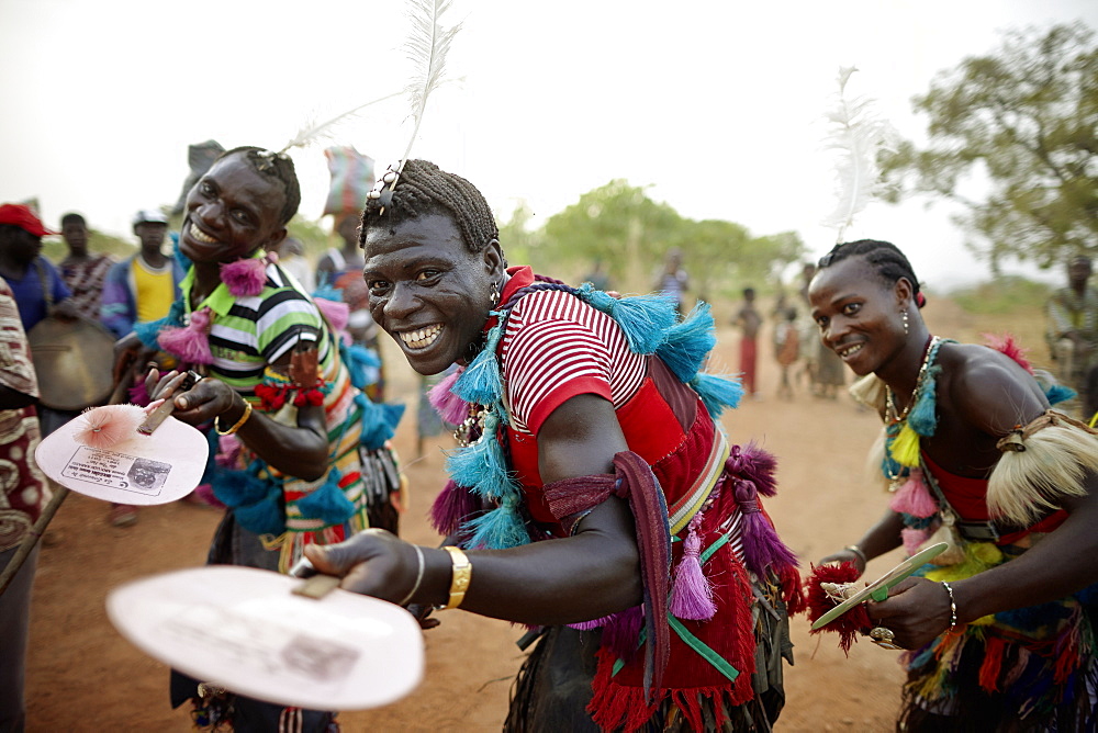 Togolese family dancing and celebrating on street, Taneka-Beri, Benin