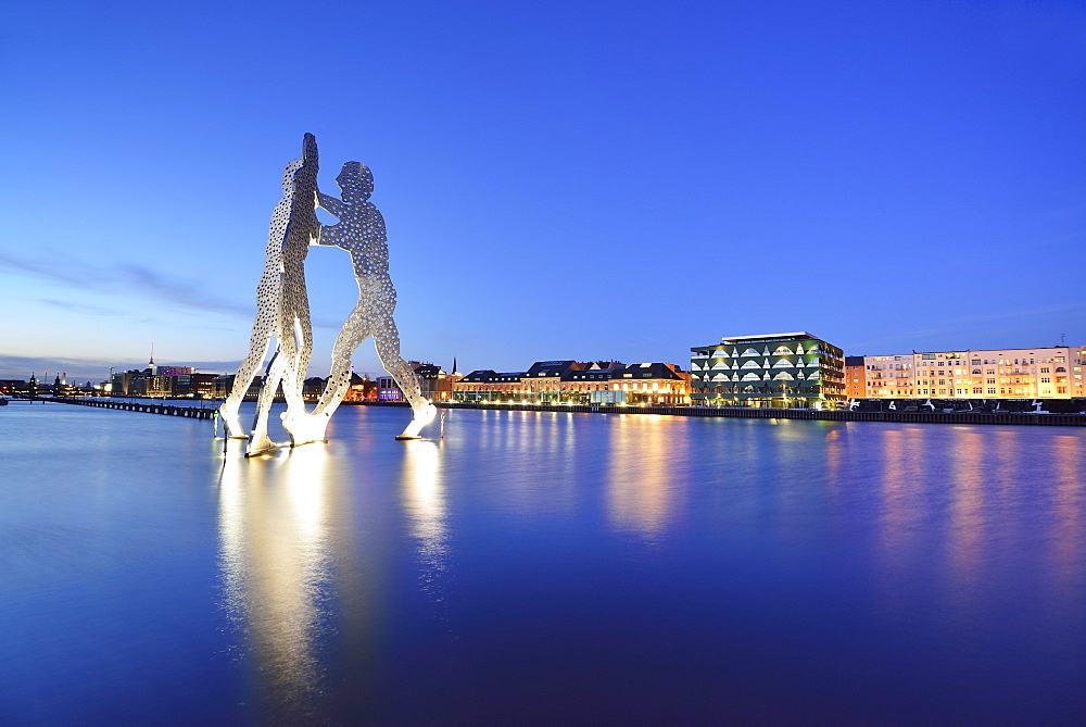 Illuminated artwork Molecule Man above the river Spree, artist Jonathan Borofsky, Berlin, Germany