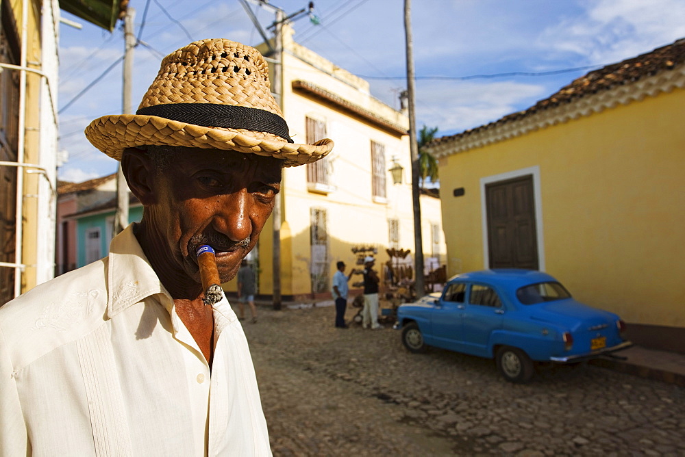 Senior man smoking cigar, Trinidad, Sancti Spiritus, Cuba, West Indies