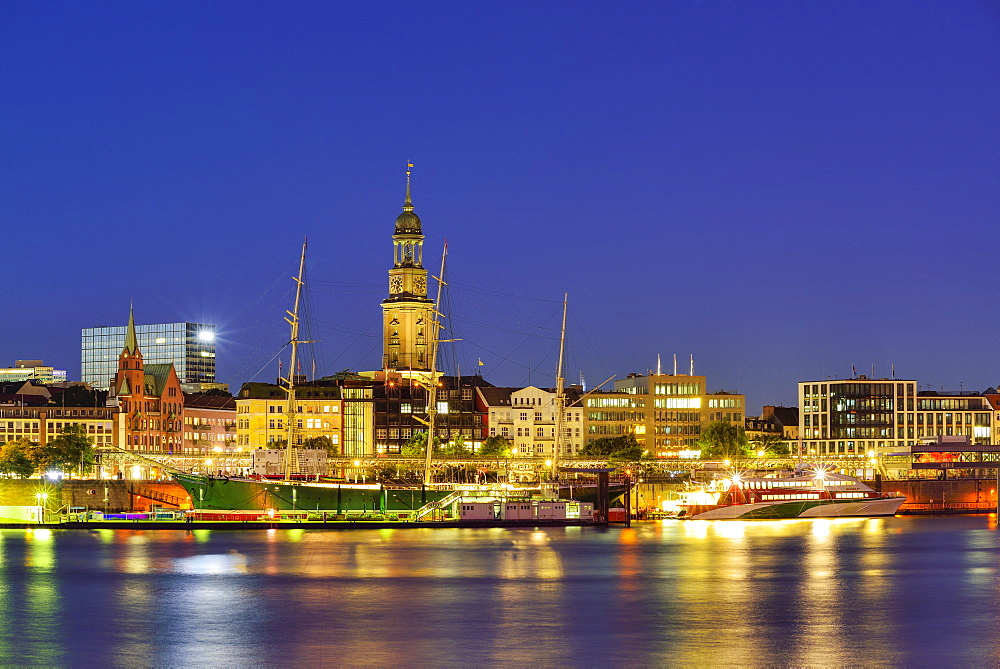 River Elbe with museum ship Rickmer Rickmers and church St. Michaelis, Michel, in the background, at night, Hamburg, Germany