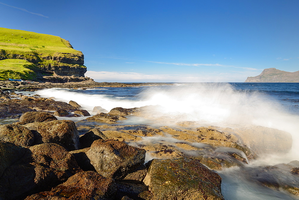 Breakwater at the rocky beach in the bay of Gjogv, Eysturoy Island, Faroe Islands