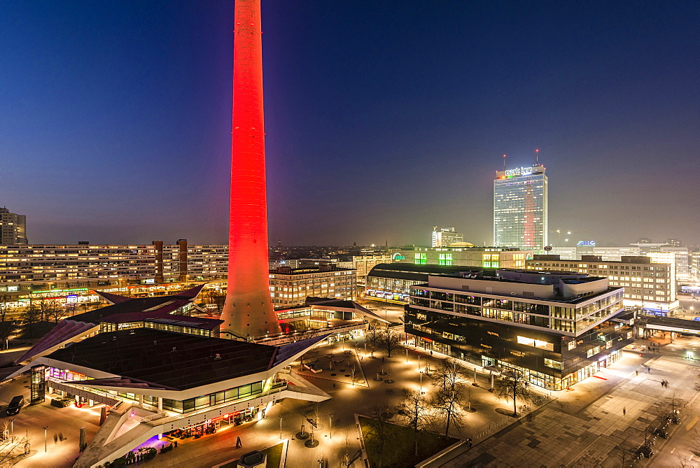 View towards Alexanderplatz at night and colorfully illuminated Alex, Berlin, Germany