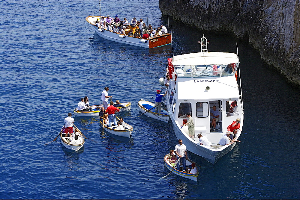 People in boats off the rocky coast, Capri, Italy, Europe